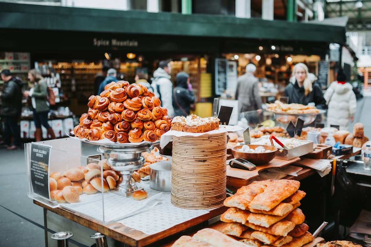 Food stalls under the covered roof of Borough Market
