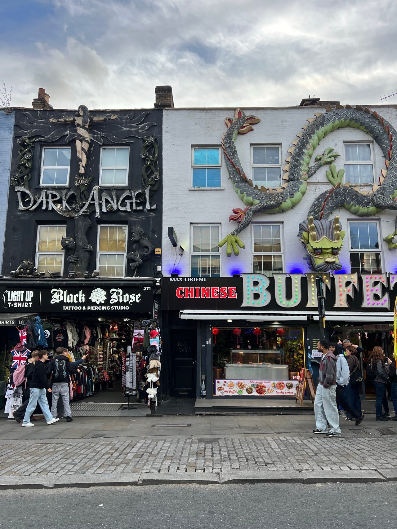 Shopfronts on Chalk Farm Road in Camden decorated with giant figures
